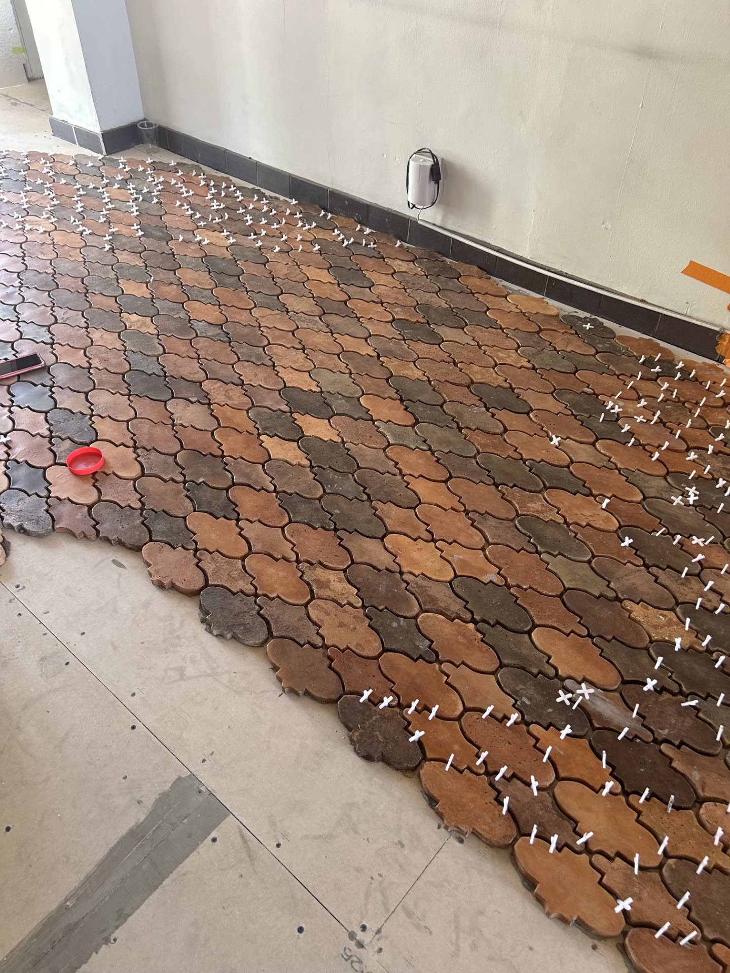 Handcrafted concrete pavers being installed in a common walkway